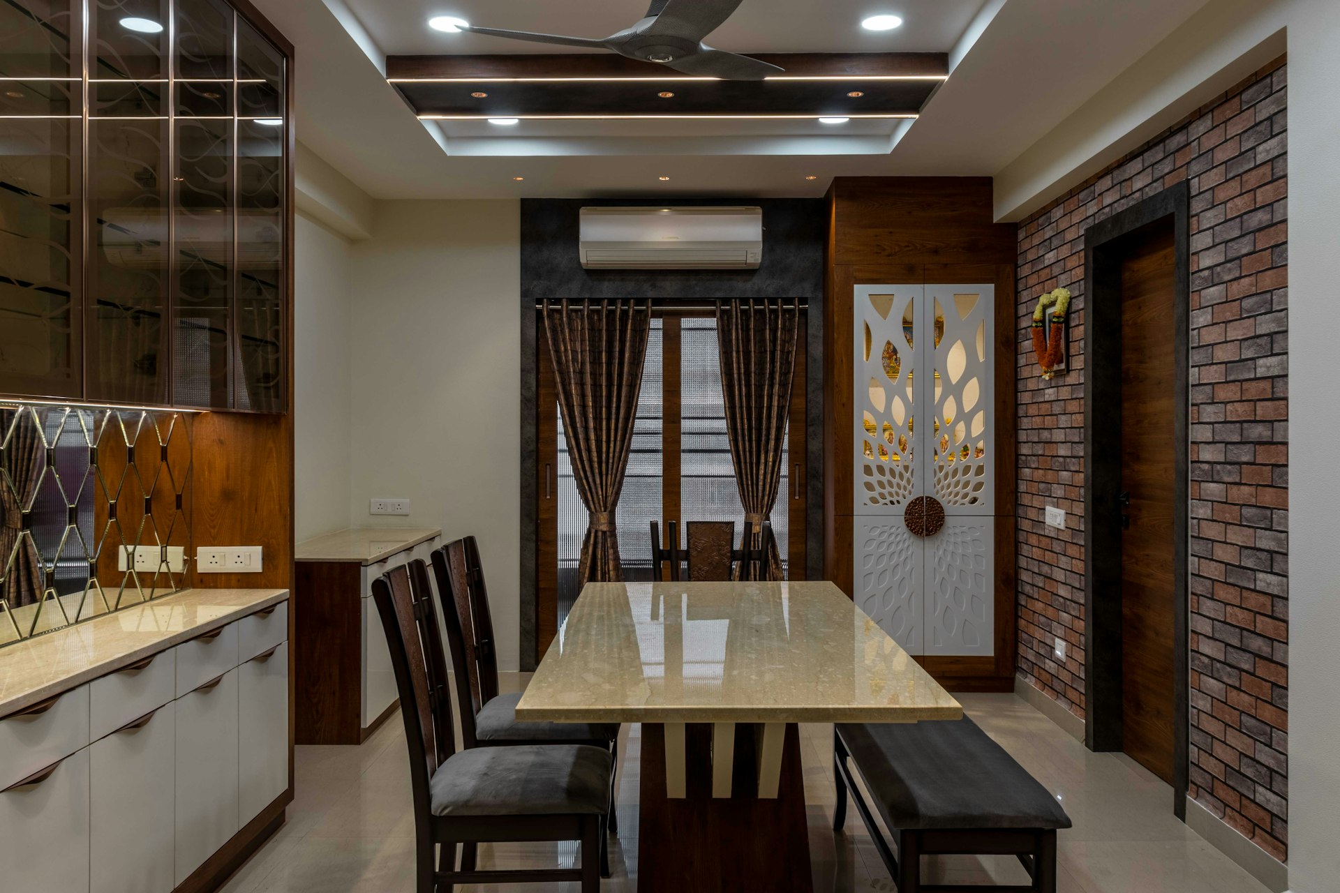 a dining room with a brick wall